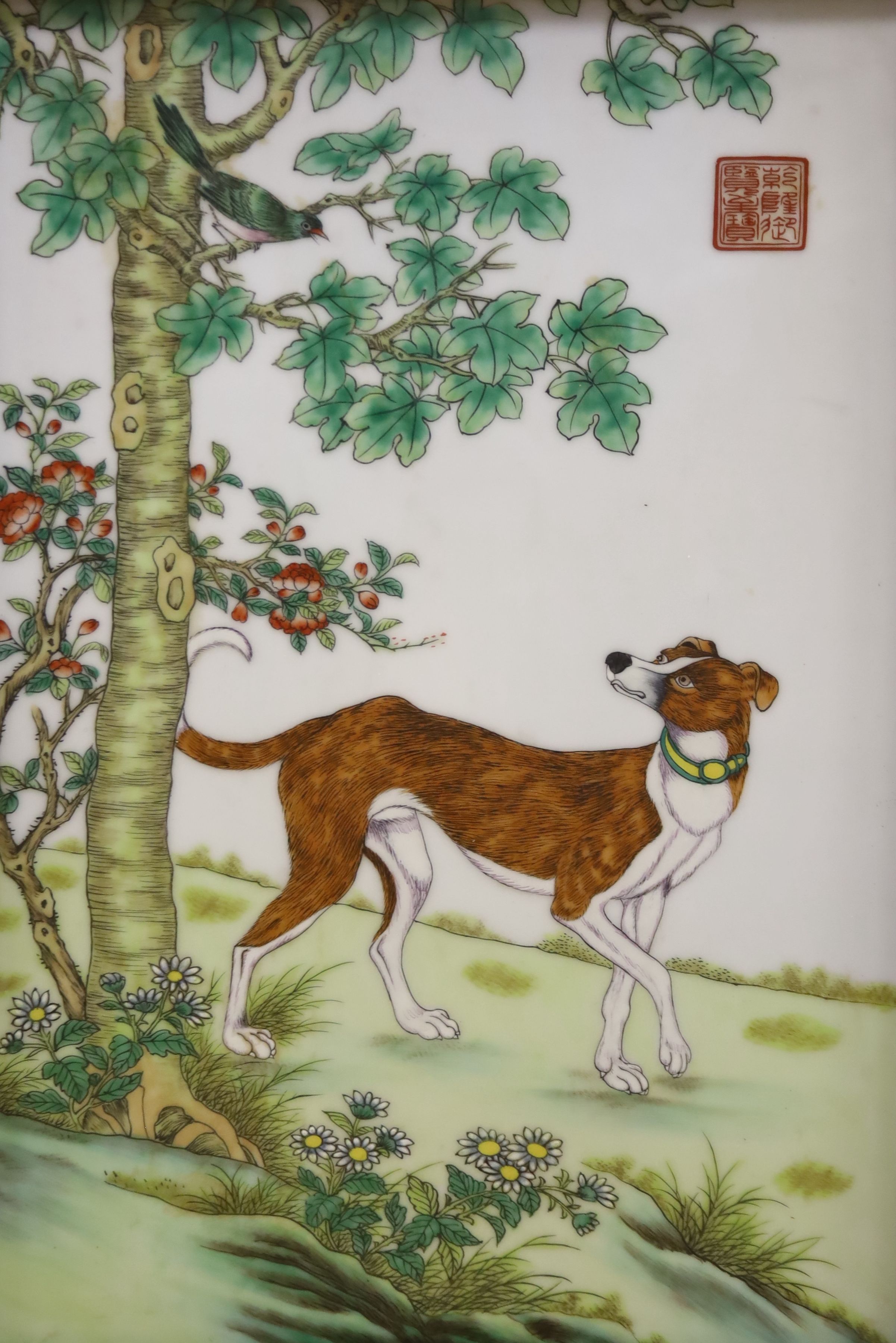 A Chinese porcelain plaque of a dog after Castiglione, 36 x 24cm, framed